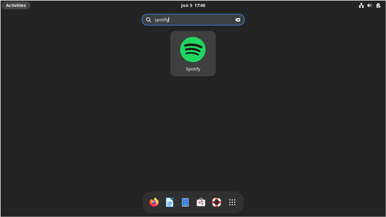 Screenshot of clicking the Spotify application icon to launch it on Debian Linux.